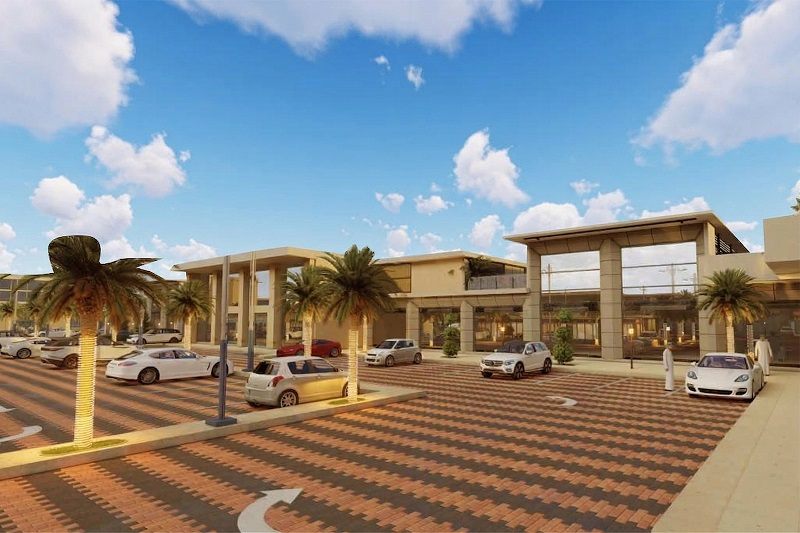 واجهة مأرب بارك نهاراً مع المواقف المرصوفة والنخيل